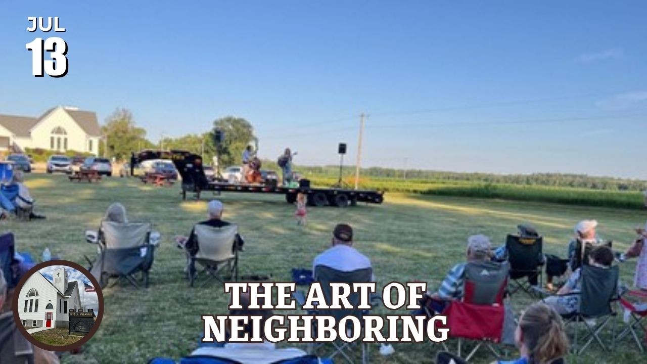 People sitting outside at a concert