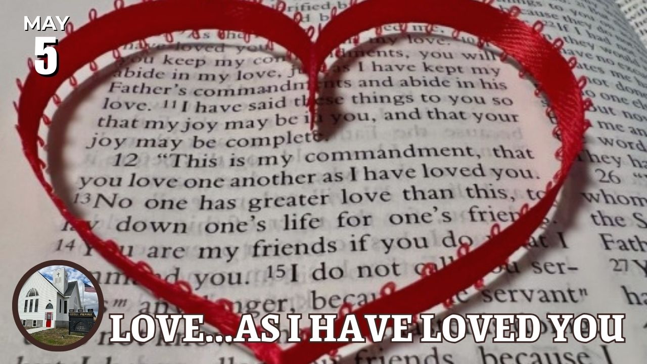 red ribbon heart on Bible page