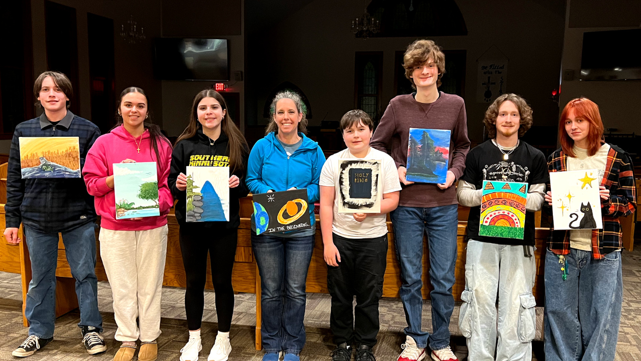 Youth holding art